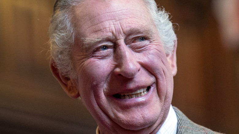 King Charles III smiling