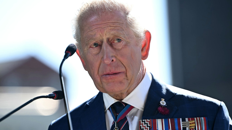 King Charles looking concerned as he delivers a speech