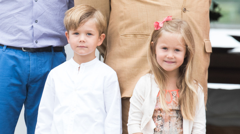 King Frederik and Queen Mary's twins Prince Vincent and Princess Josephine pose for photographers outside the royal palace.