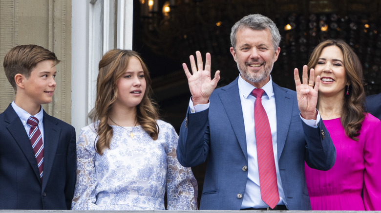 King Frederik and Queen Mary smile and wave to the press with their twins in 2024
