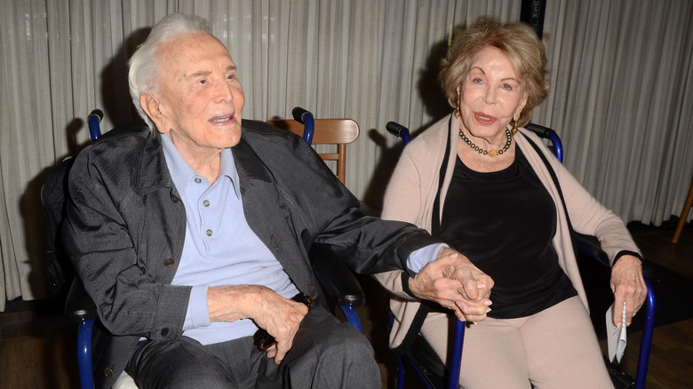 Kirk Douglas and Anne Douglas sitting