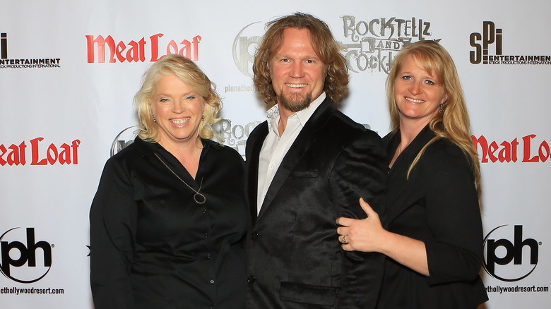 Janelle, Kody, and Christine Brown smiling