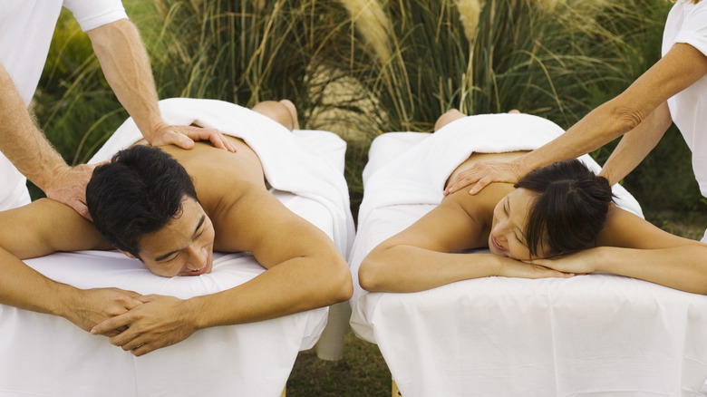 Asian couple receiving massage