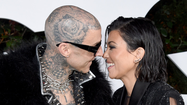 Travis Barker and Kourtney Kardashian about to kiss