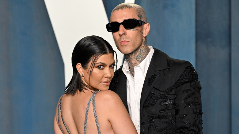Kourtney Kardashian & Travis Barker posing