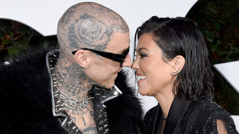 Travis Barker and Kourtney Kardashian about to kiss