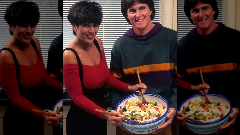 Kris Jenner in a red outfit posing with salad next to Caitlyn Jenner