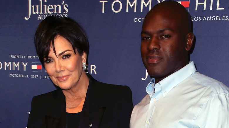 Kris Jenner wearing a black blazer and Corey Gamble waring a light blue button-down shirt.