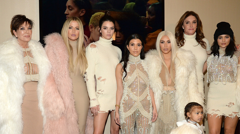 The Kardashian-Jenner family posing in elaborate furs