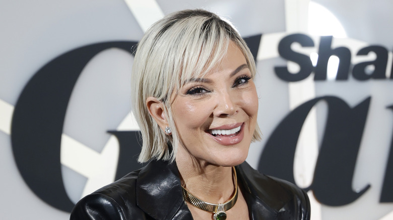 A blond Kris Jenner smiling at an event in 2025
