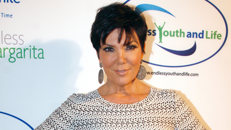 Kris Jenner posing on step-and-repeat