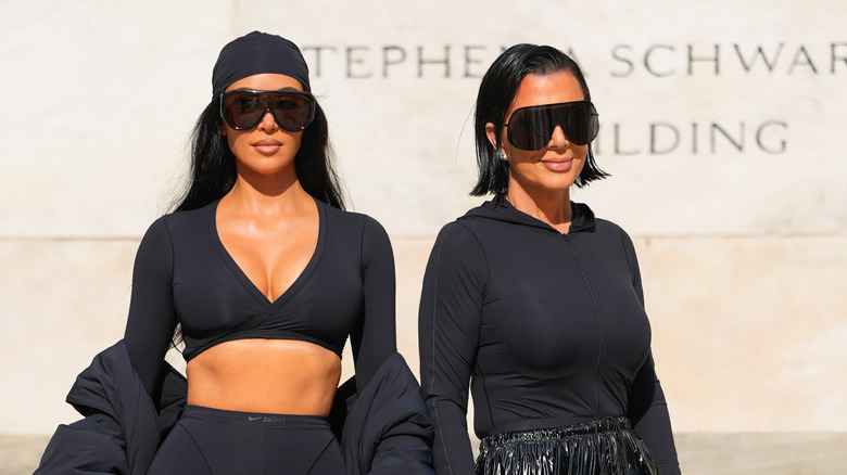 Kim Kardashian and Kris Jenner at an event both dressed in black with big sunglasses