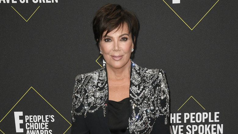 Kris Jenner posing on step-and-repeat