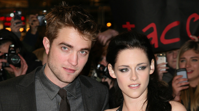 Kristen Stewart and Robert Pattinson at an event. 