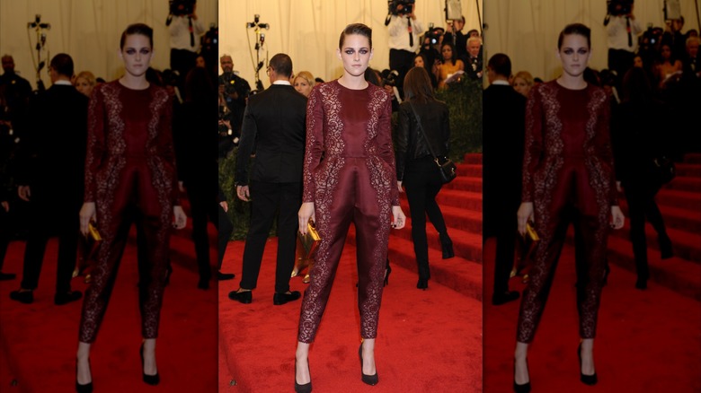 Kristen Stewart wearing a burgundy red jumpsuit at the Met Gala.