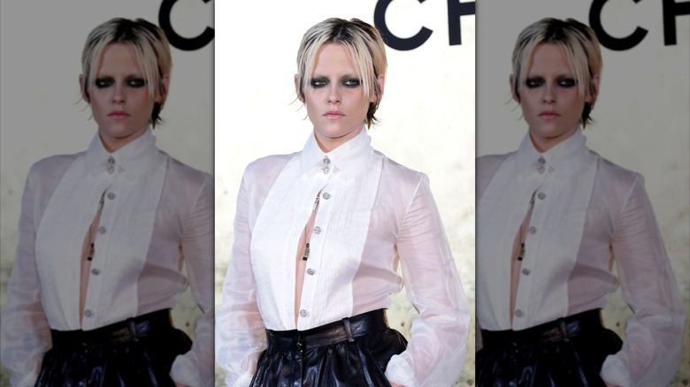 Kristen Stewart with bleached eyebrows at a fashion show.