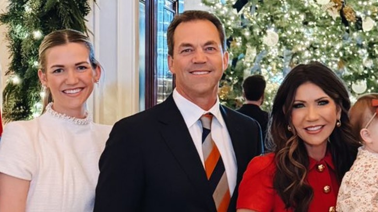 Kassidy Noem Peters, Bryon Noem, and Kristi Noem in a family photo at the White House Christmas party