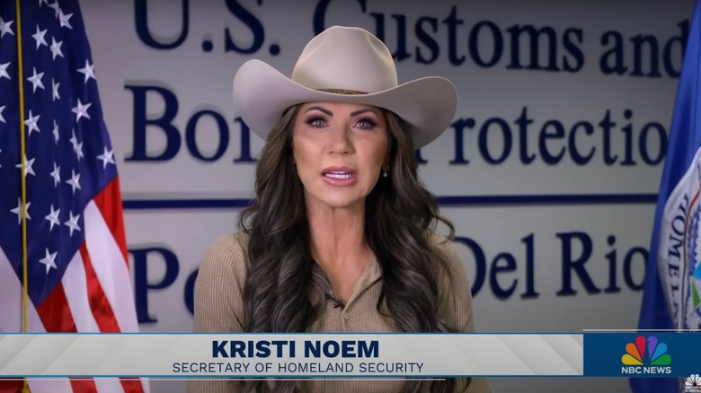 Kristi Noem wearing a cowboy hat while being interviewed on Meet the Press