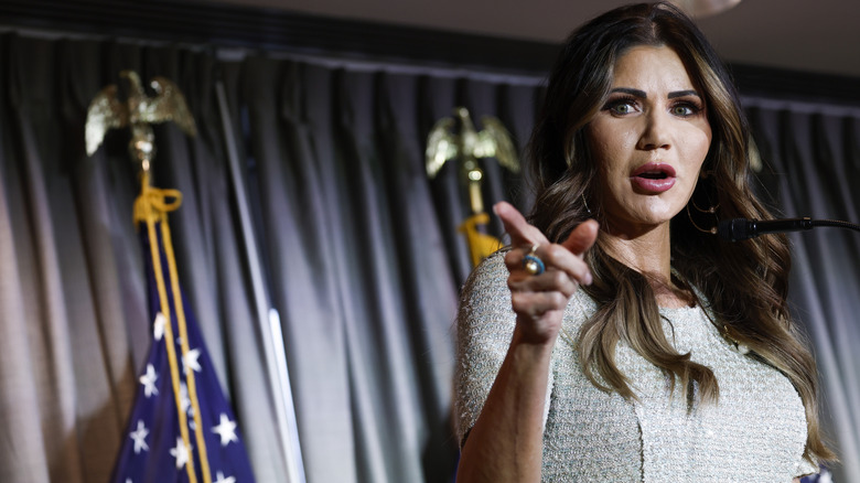 Kristi Noem pointing a finger at someone while delivering a speech