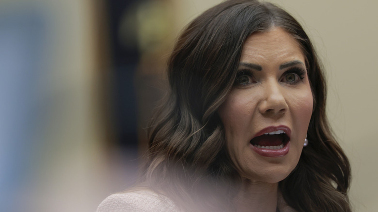 Kristi Noem looking anxious with her mouth open