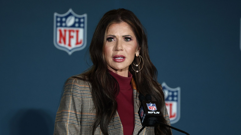 Kristi Noem speaking at a podium