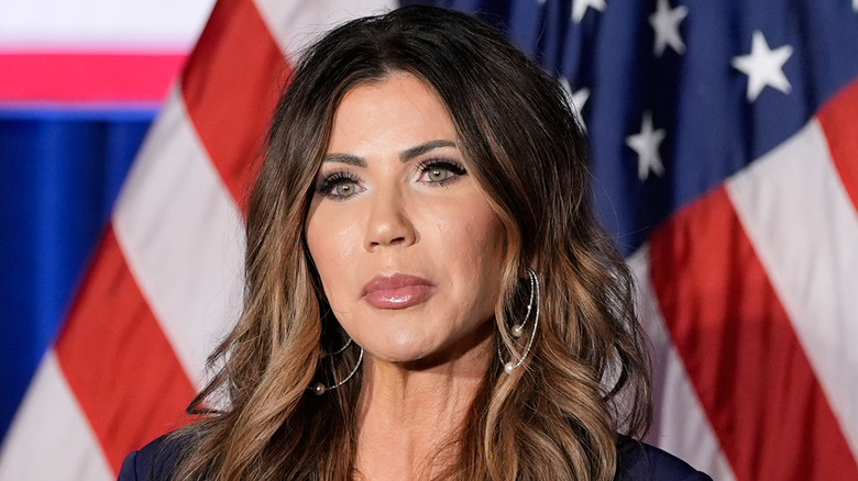 Kristi Noem speaking at a podium