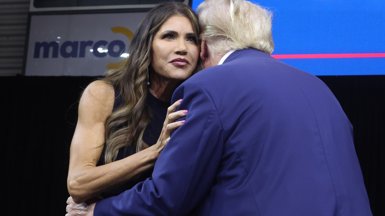 Kristi Noem hugging Donald Trump