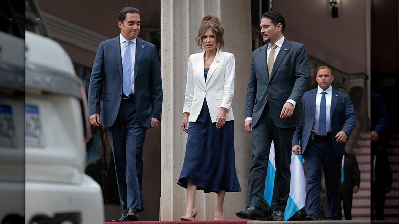 Kristi Noem walking and giving side eye