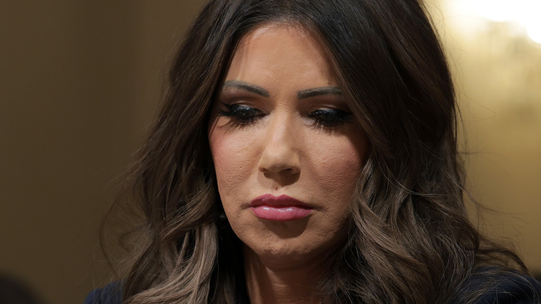 Kristi Noem looking down