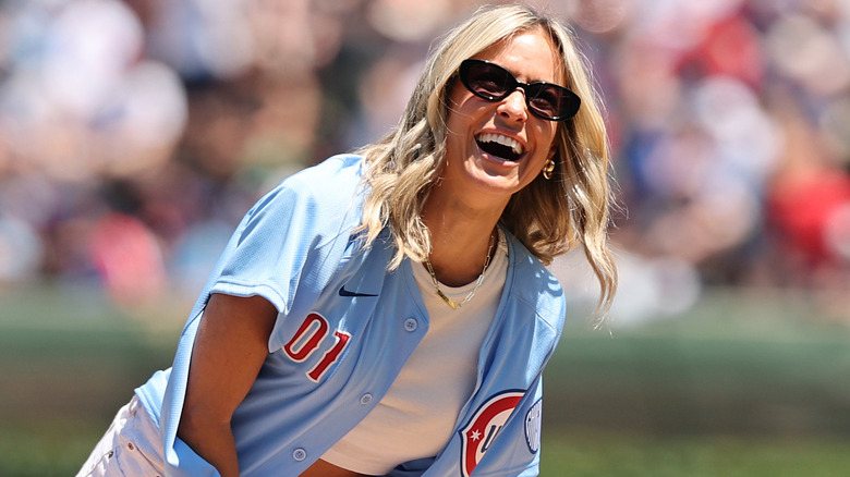 Kristin Cavallari smiling wearing Chicago Cubs throwback jersey