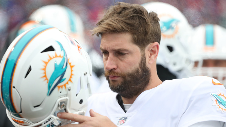 Jay Cutler taking off his Miami Dolphins helmet