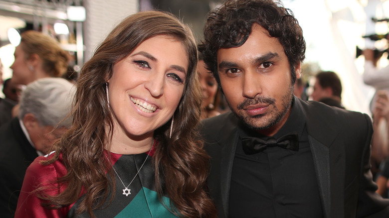 Mayim Bialik and Kunal Nayyar posing at event