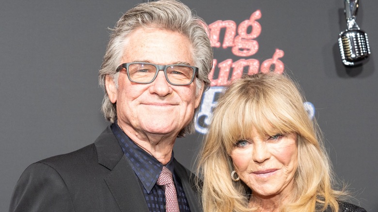 Kurt Russell and Goldie Hawn wear formal clothes at a premiere