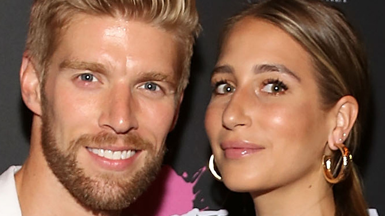 Kyle Cooke and Amanda Batula posing together on red carpet