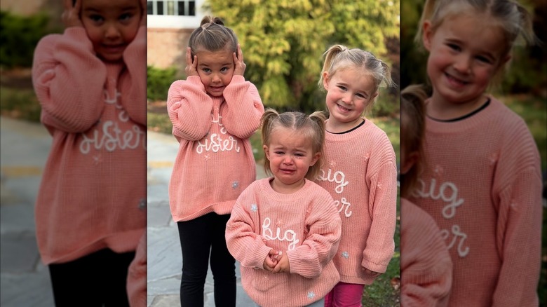 The three Kelce daughters in pink knitted sweaters with Bennett crying in front