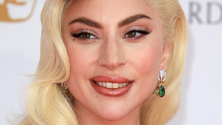 Lady Gaga smiling on the red carpet
