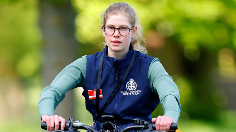 Lady Louise Windsor looking introspective while she rides a bike