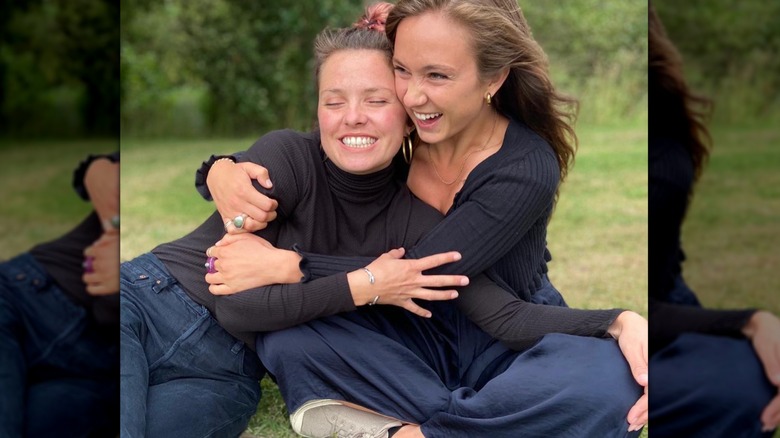 Lady Marina Windsor hugging a friend outside