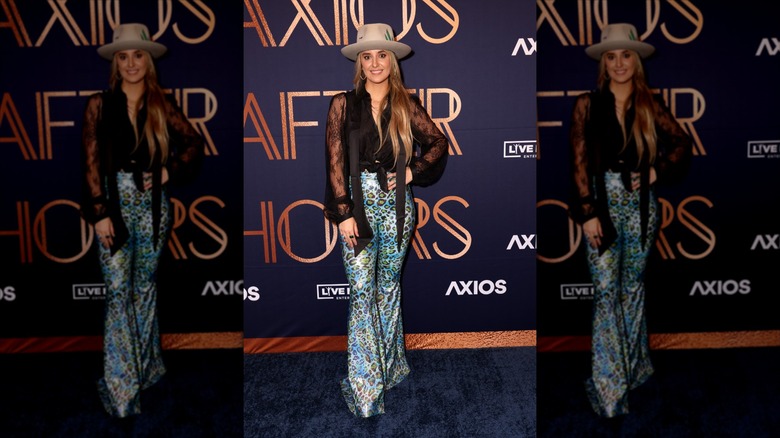 Lainey Wilson in blue cheetah print pants