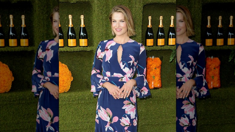 Ali Larter in 2017 with a mid-length bob wearing a navy dress with a pink floral print