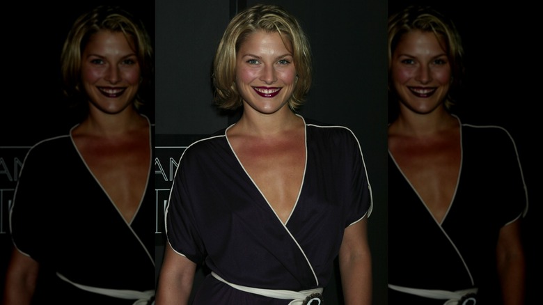 Ali Larter wearing a black dress with white accents and shorter hair in 2002