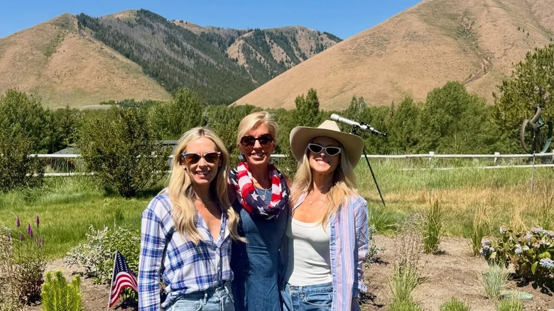 Ali Larter smiling with two other blonde women in Idaho with the mountains behind them