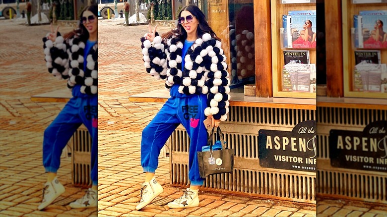 Erin Elmore sticking out her tongue and making a peace sign