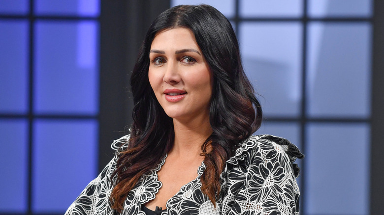 Erin Elmore looking serious and glancing to the side