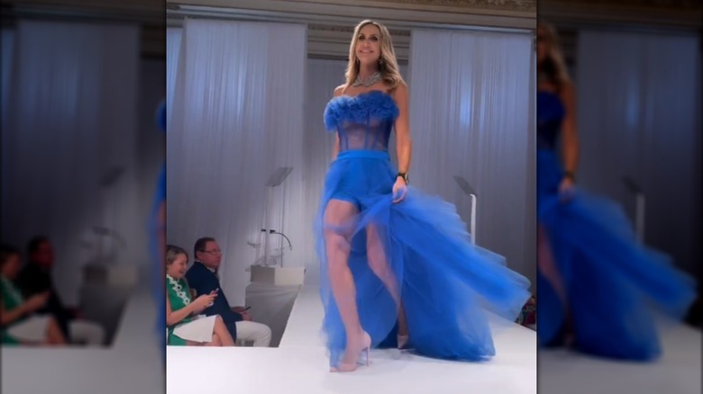 Lara Trump walking the runway in a blue dress