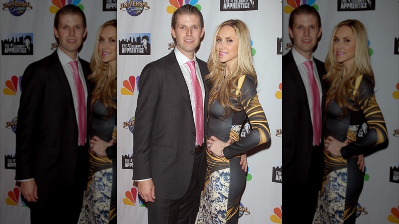 Eric Trump posing with his arm around Lara Trump at 2015 "Celebrity Apprentice" finale