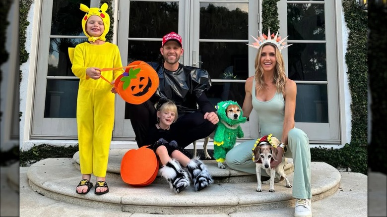 Lara Trump wearing a Statue of Liberty costume and posing with family