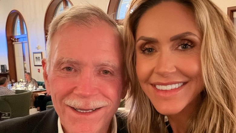 Robert Yunaska and Lara Trump pose together for a birthday celebration in 2025