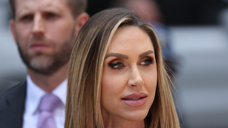 Lara Trump stands in front of husband Eric Trump
