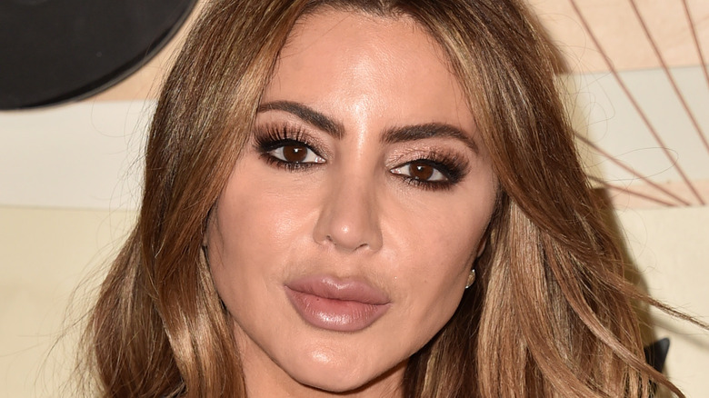 Larsa Pippen posing on red carpet with shimmery smoky eye 